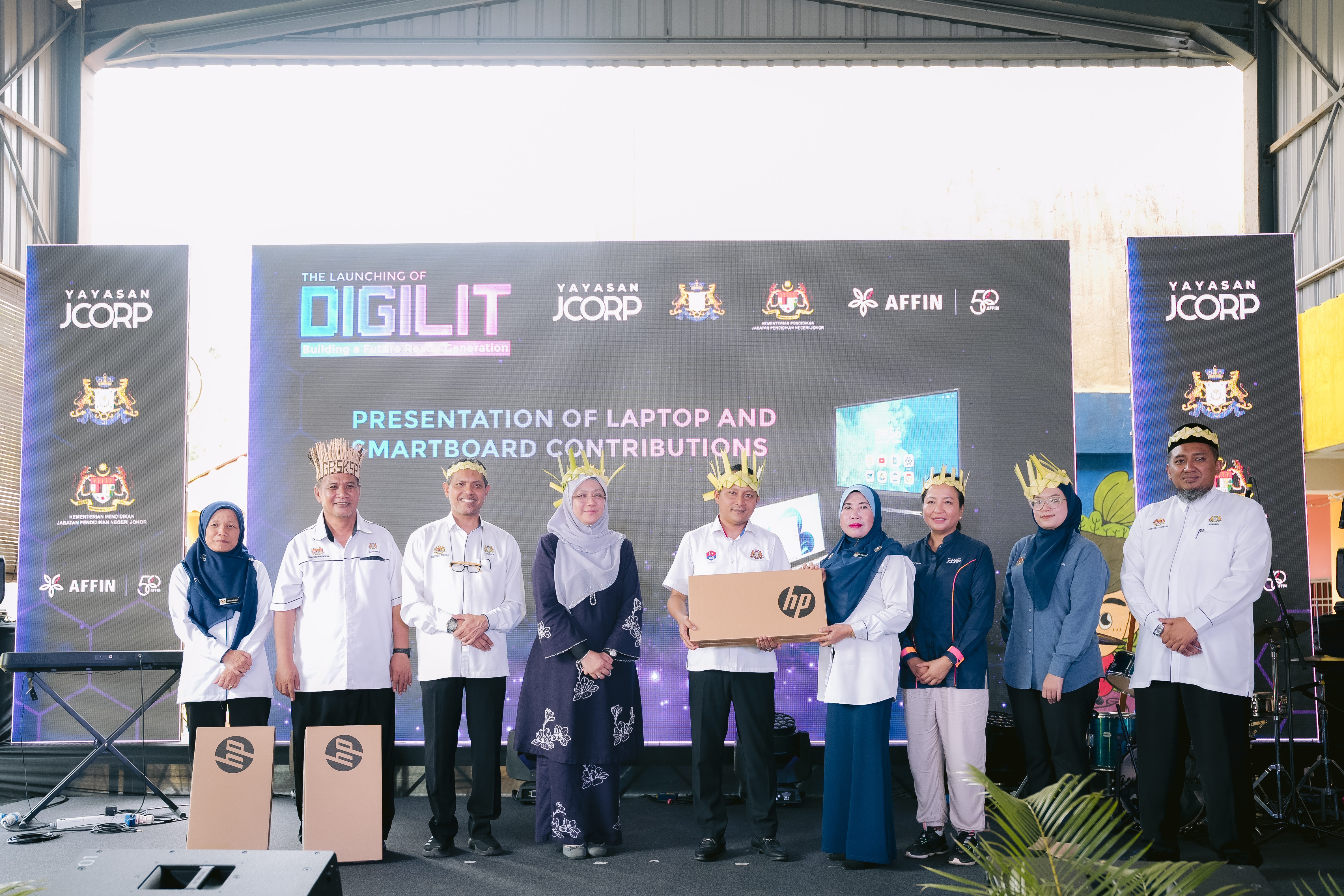 Orang Asli parents, pupils grateful to receive laptops